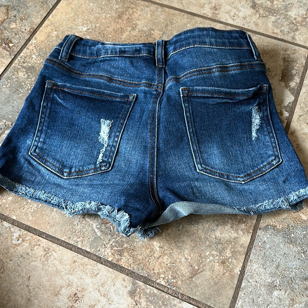 Size medium Jean shorts with fraying at bottom
